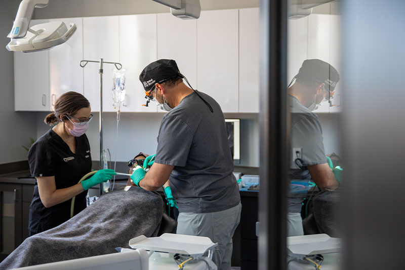 doctor going through procedure on patient