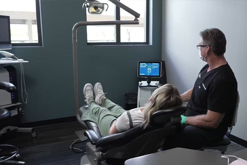 Doctor and patient looking at a Lanap Machine